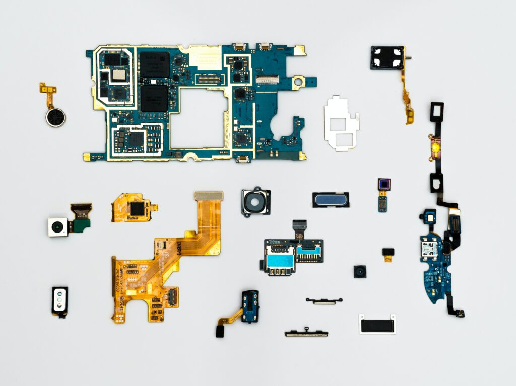 different pieces of IoT hardware on a grey background